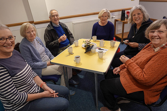 Ann enjoying coffee at Beacon Volunteers Party at Church