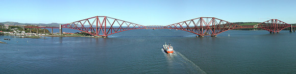 Ship passing under the Forth Bridge